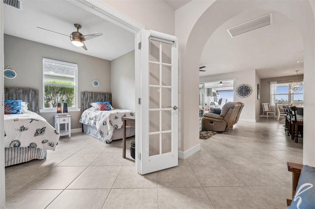 bedroom featuring light tile patterned flooring and ceiling fan