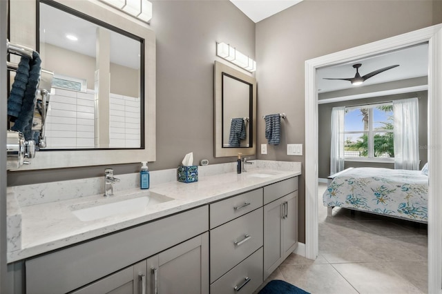 bathroom with ceiling fan, tile patterned flooring, and vanity