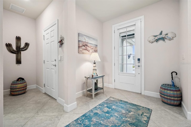 foyer featuring light tile patterned floors