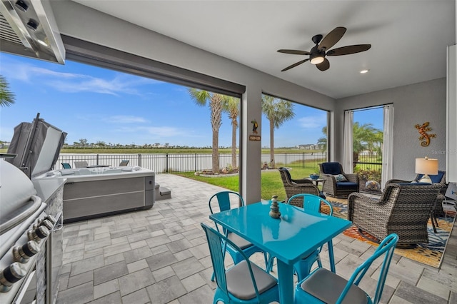 view of patio / terrace with a grill, a hot tub, an outdoor hangout area, and ceiling fan