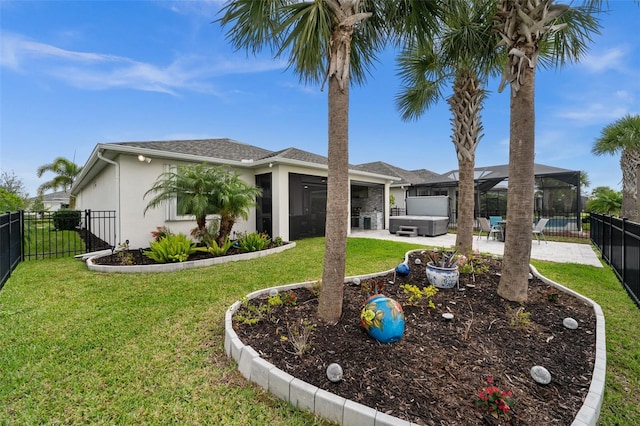 single story home featuring a front lawn, a lanai, a patio area, and a hot tub