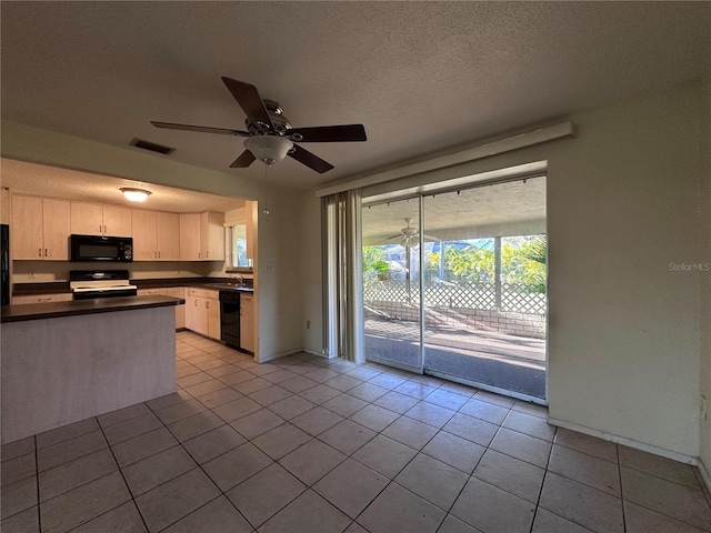 kitchen featuring visible vents, black appliances, a ceiling fan, dark countertops, and a textured ceiling