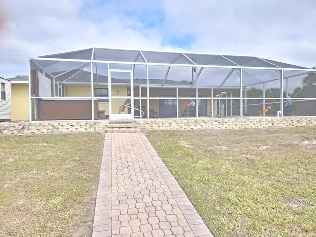 exterior space featuring a lanai and a front yard