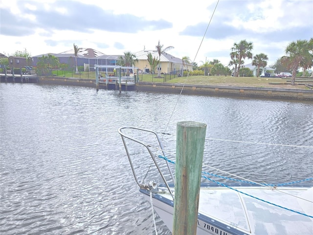 view of dock featuring a residential view and a water view