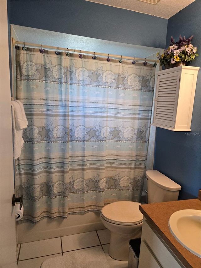 bathroom featuring a textured ceiling, tile patterned flooring, toilet, vanity, and shower / tub combo with curtain