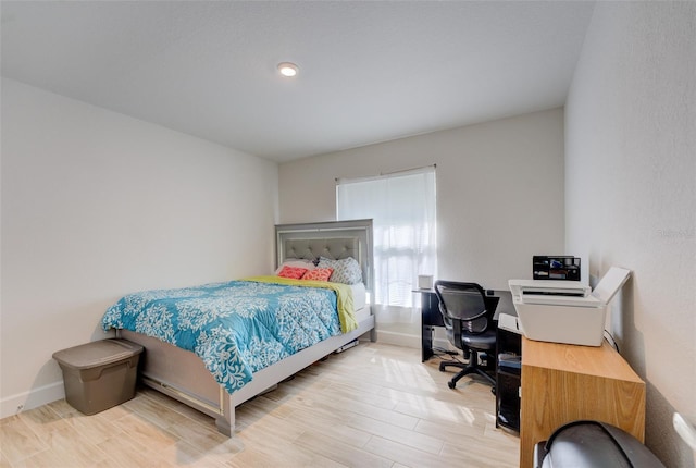 bedroom with light wood-type flooring