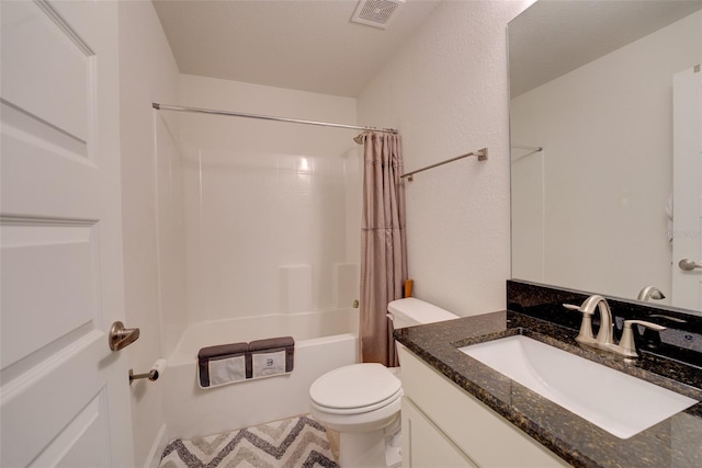 full bathroom featuring shower / bath combo with shower curtain, vanity, and toilet