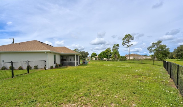 view of yard with a sunroom