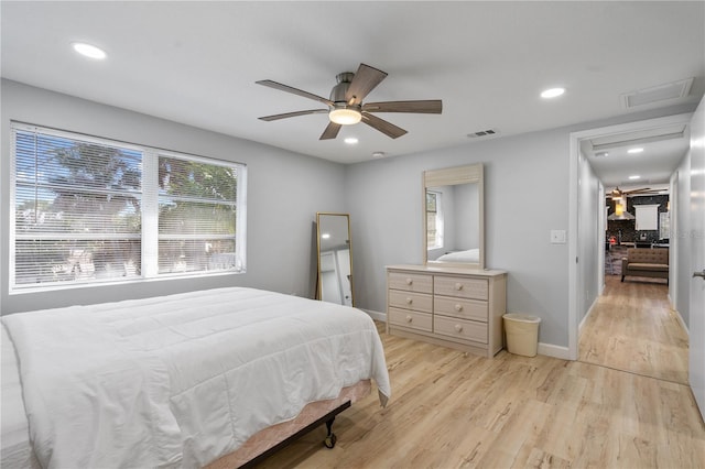 bedroom featuring light hardwood / wood-style flooring and ceiling fan