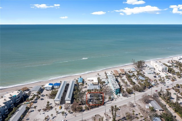 bird's eye view with a water view and a view of the beach