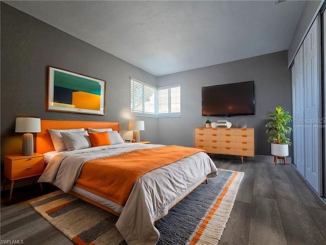 bedroom featuring wood finished floors