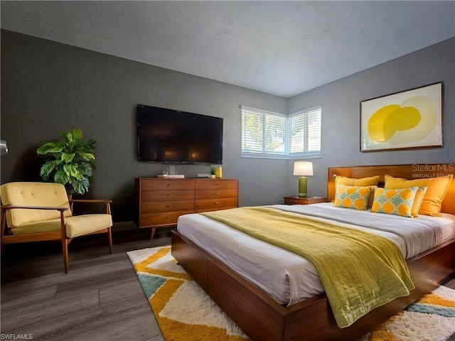 bedroom with wood finished floors