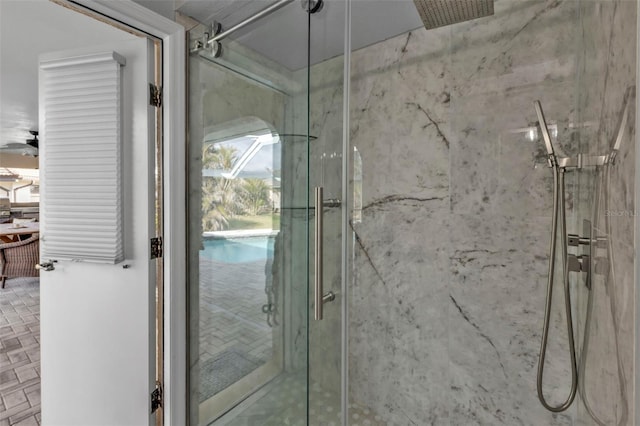 bathroom with a marble finish shower