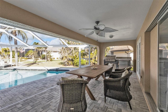 view of patio / terrace with glass enclosure, area for grilling, a ceiling fan, and an outdoor pool