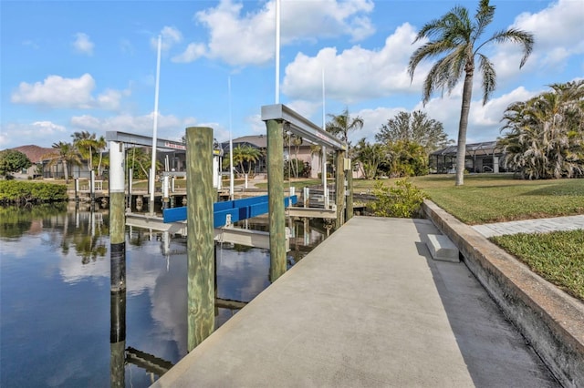 dock area featuring a yard, a water view, and boat lift