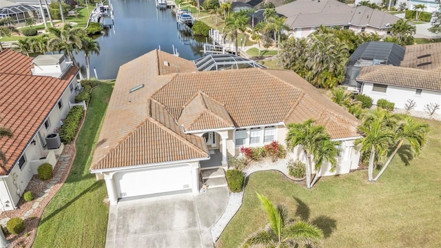 drone / aerial view featuring a residential view and a water view