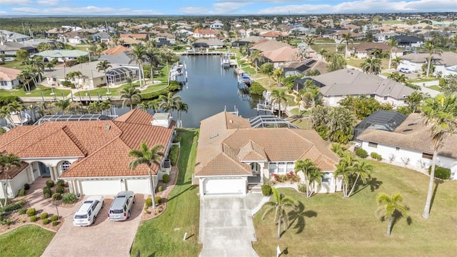 bird's eye view with a residential view and a water view