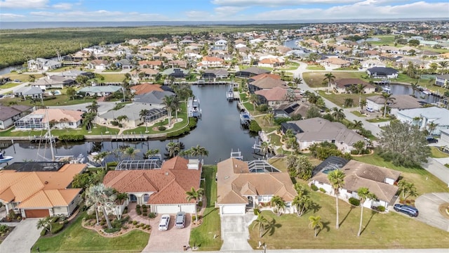 aerial view with a water view and a residential view