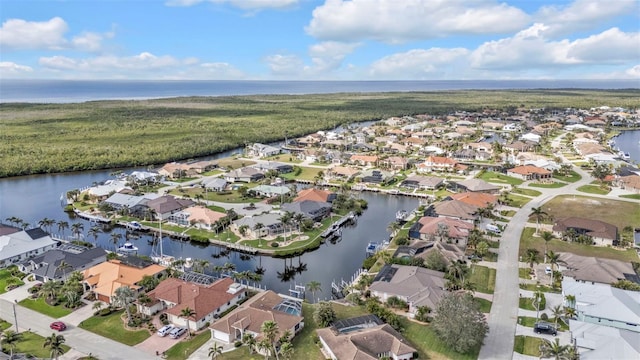 aerial view with a residential view and a water view