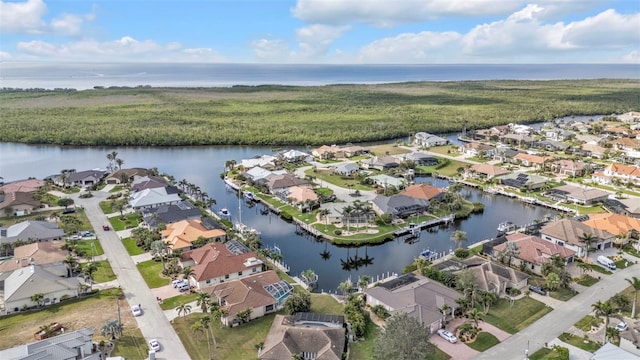 birds eye view of property featuring a residential view and a water view