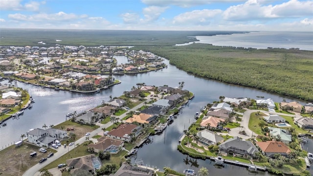 birds eye view of property featuring a residential view and a water view