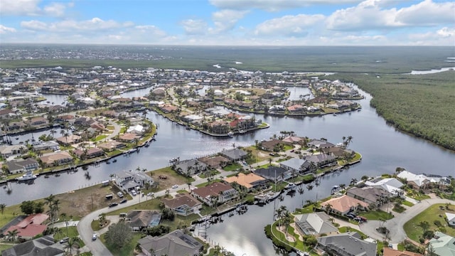 aerial view with a water view and a residential view