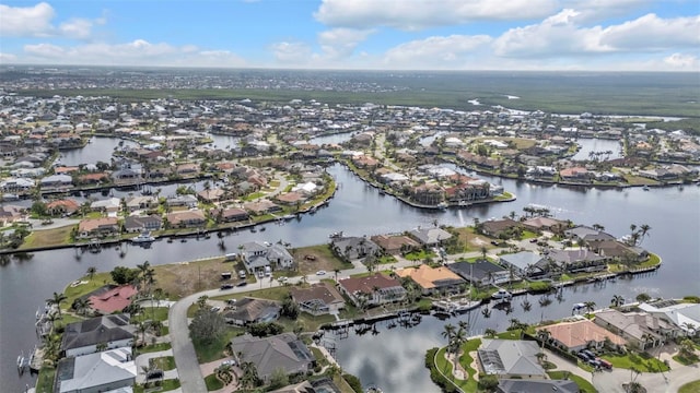 aerial view with a water view and a residential view