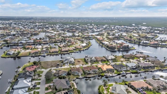 bird's eye view with a residential view and a water view