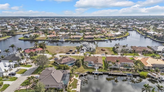 aerial view with a water view and a residential view