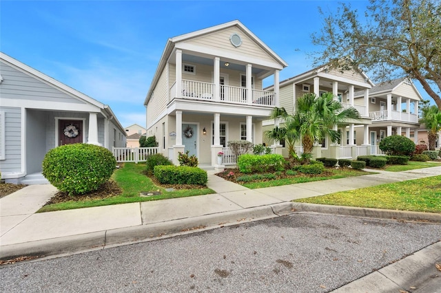 view of front of property with a porch and a balcony