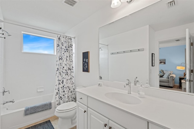 bathroom featuring shower / tub combo, visible vents, vanity, and toilet