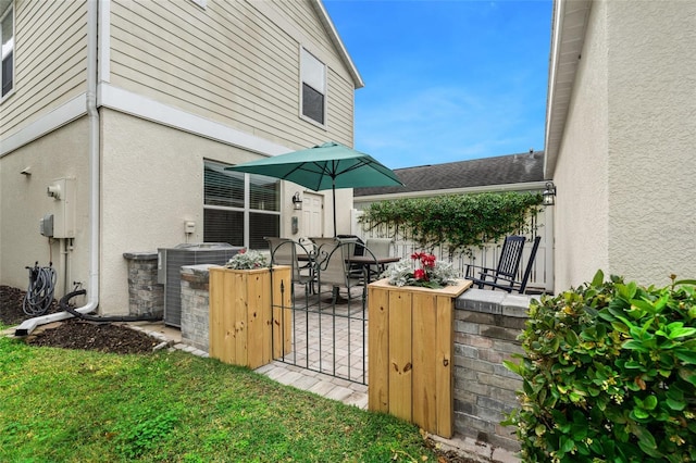 view of patio featuring fence and outdoor dining space