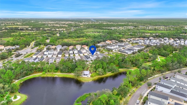 birds eye view of property with a water view and a residential view