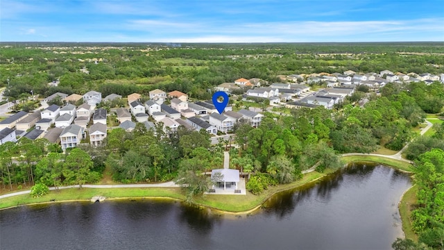 drone / aerial view with a water view and a residential view