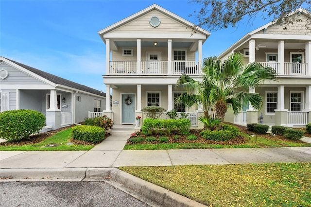 view of front of home with covered porch and a balcony