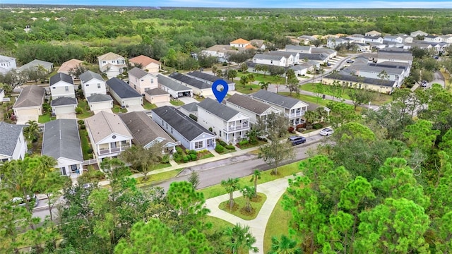 aerial view with a residential view and a view of trees