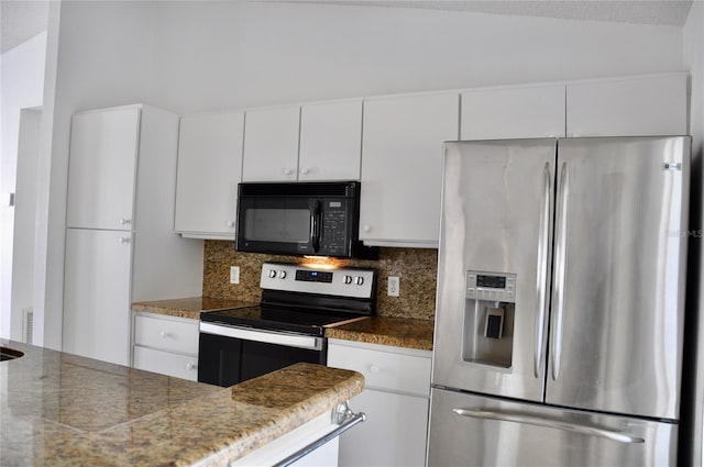 kitchen featuring stainless steel appliances, white cabinetry, and decorative backsplash