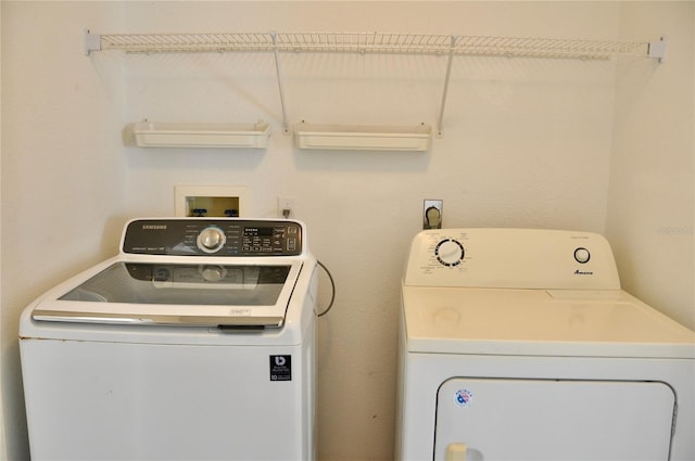 laundry area featuring laundry area and washer and clothes dryer