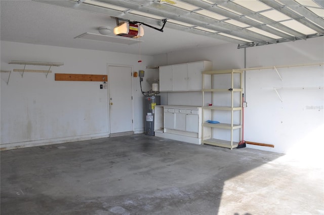 garage featuring water heater and a garage door opener