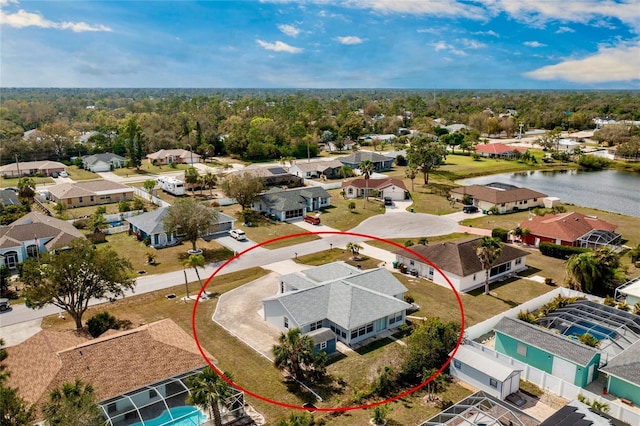 bird's eye view featuring a water view and a residential view