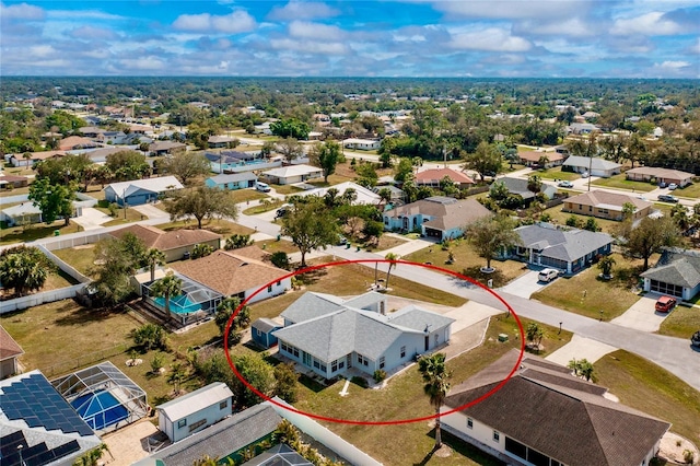 birds eye view of property with a residential view