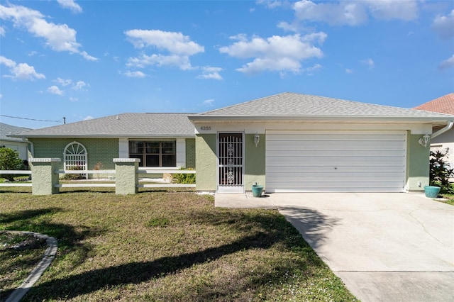 ranch-style house with a garage, driveway, fence, a front lawn, and stucco siding