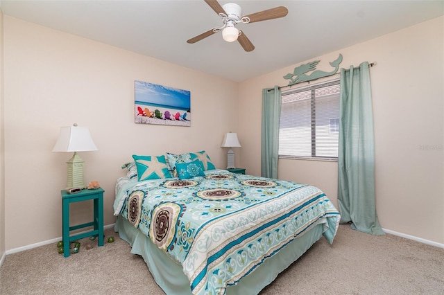 bedroom featuring ceiling fan, baseboards, and light colored carpet