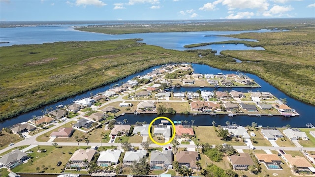 bird's eye view with a water view and a residential view