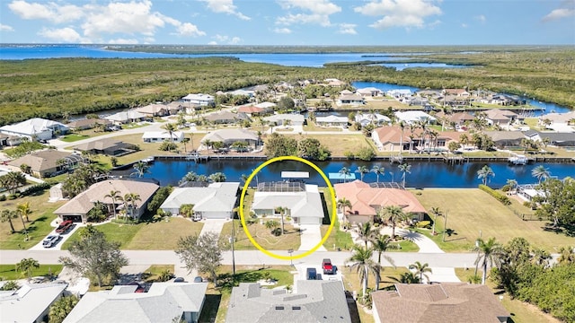 bird's eye view with a residential view and a water view