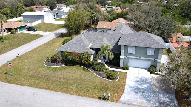 birds eye view of property with a residential view