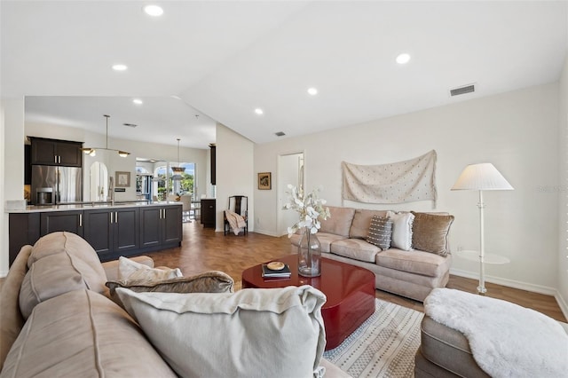 living area with lofted ceiling, parquet floors, baseboards, and recessed lighting