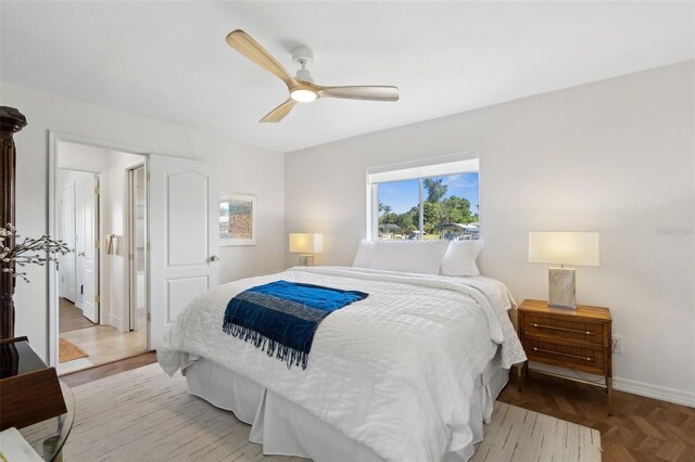 bedroom featuring a ceiling fan and baseboards