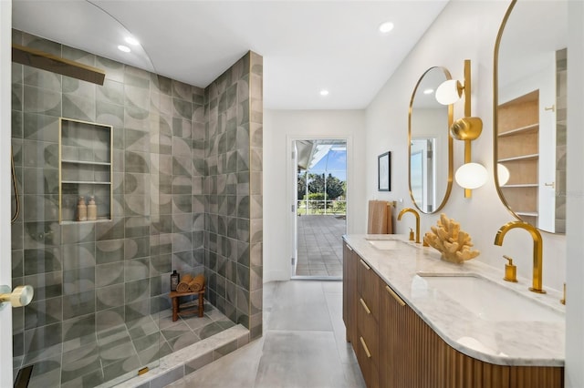 full bath with double vanity, a walk in shower, a sink, and recessed lighting