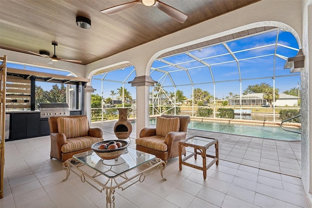 view of patio / terrace with glass enclosure, an outdoor pool, grilling area, and ceiling fan